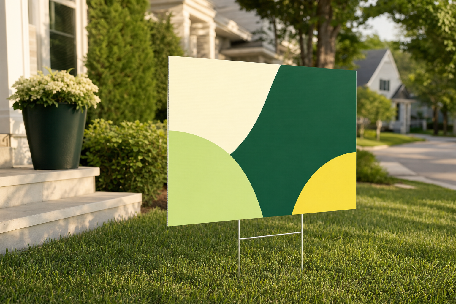 Coroplast lawn sign installed with an H-stake on a residential lawn